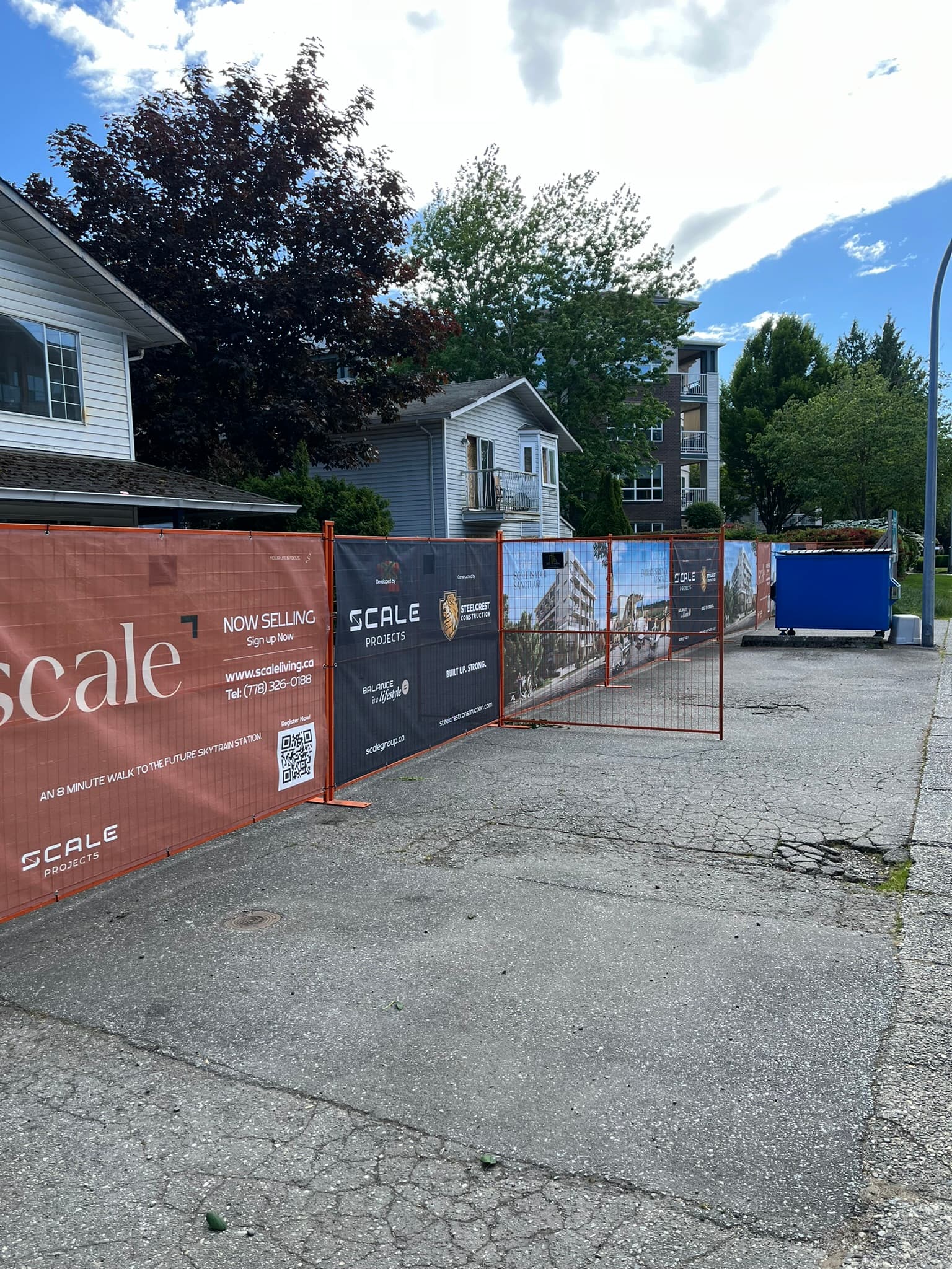 Temporary fencing with privacy screening on a development site