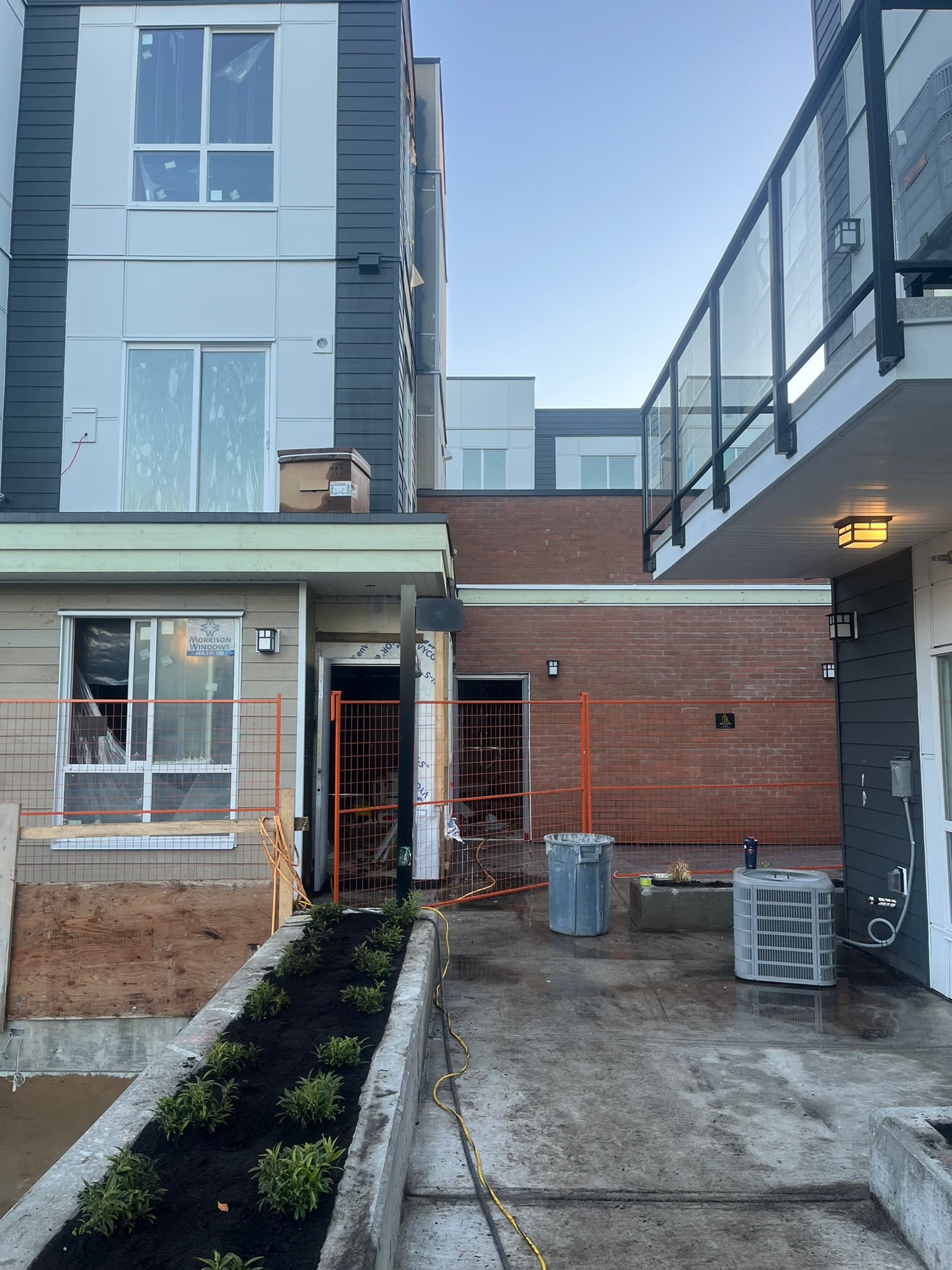 Temporary fence panels around a townhouse construction project